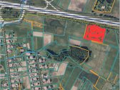 Sklypas prie didžiausią automobilių srautą