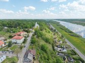 Rąstinis namas su 17 arų sklypu istorinėje